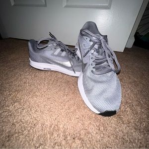 Silver Nike running shoes